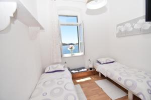 Кровать или кровати в номере Apartmani Rina