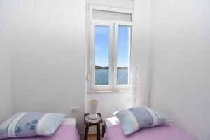 Кровать или кровати в номере Apartmani Rina
