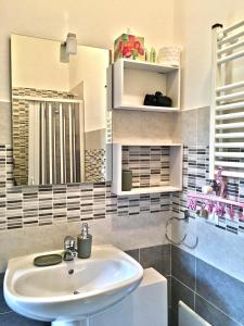 a bathroom with a sink and a mirror at B&B MaryGrace in Alghero +31 photos