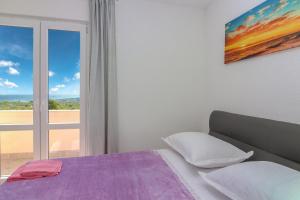 Postel nebo postele na pokoji v ubytování Conte Čikara Apartment