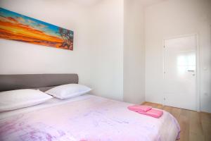 Postel nebo postele na pokoji v ubytování Conte Čikara Apartment
