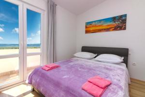 Postel nebo postele na pokoji v ubytování Conte Čikara Apartment