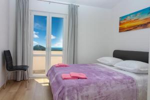 Postel nebo postele na pokoji v ubytování Conte Čikara Apartment