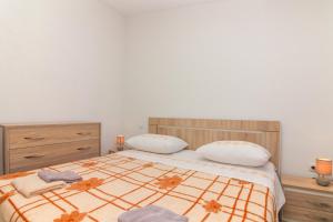Postel nebo postele na pokoji v ubytování Conte Čikara Apartment