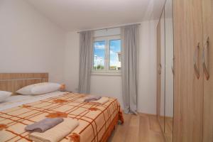 Postel nebo postele na pokoji v ubytování Conte Čikara Apartment