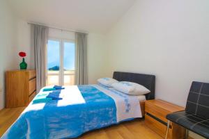 Postel nebo postele na pokoji v ubytování Conte Čikara Apartment
