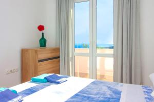 Postel nebo postele na pokoji v ubytování Conte Čikara Apartment