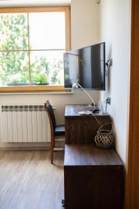 TV a/nebo společenská místnost v ubytování Apartmány VÍNO HRUŠKA Pardubice