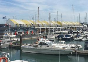 a group of boats docked in a marina at Brighton Marina Floating home in Brighton & Hove