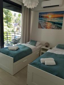 Posteľ alebo postele v izbe v ubytovaní Aprum Apartments 12C