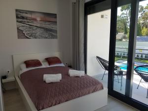 Posteľ alebo postele v izbe v ubytovaní Aprum Apartments 12C