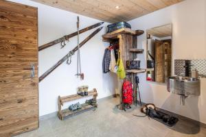 a room with various items on the wall at Mountain Chalet 4 You in Zermatt