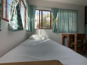 Postel nebo postele na pokoji v ubytování Bermejo Hostel