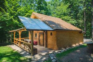 a large wooden cabin with a pitched roof at Chata Hlboké in Bojnice