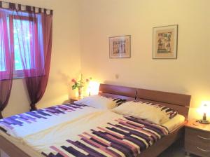 Postel nebo postele na pokoji v ubytování Apartments Coral, Klimno, island Krk