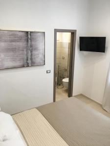 Postel nebo postele na pokoji v ubytování Maestrale Charme Rooms