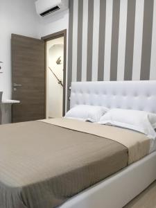 Postel nebo postele na pokoji v ubytování Maestrale Charme Rooms