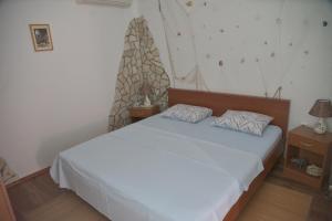 Cama o camas de una habitación en Apartments Uskok