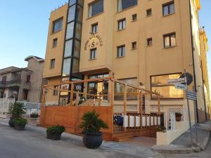 a building on the corner of a street at Hotel Miravalle in Ribera