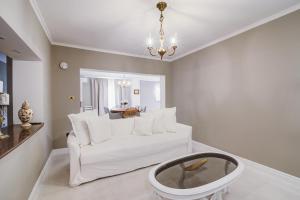 a living room with a white couch and a table at Apartment Lara in Senj
