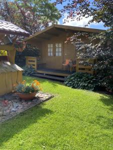 a small house with a yard with a yard at Vacation Without Make Up in Šventoji