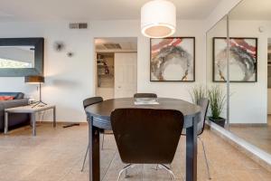 a dining room with a table and chairs at 1 bedroom unit ground floor in Chandler