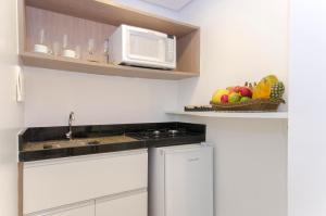 Kuchyň nebo kuchyňský kout v ubytování Hotel Adrianópolis All Suites