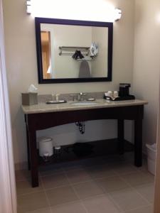 a bathroom with a sink and a mirror at Casa de Fruta Inn in Hollister