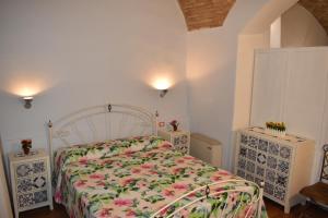 Borgo San Sisto Apartment tesisinde bir odada yatak veya yataklar