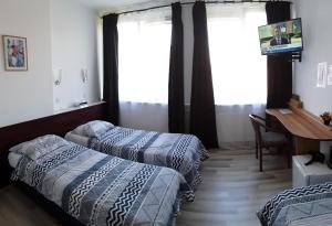 Postel nebo postele na pokoji v ubytování Hotel Baan