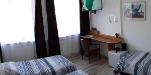 Postel nebo postele na pokoji v ubytování Hotel Baan