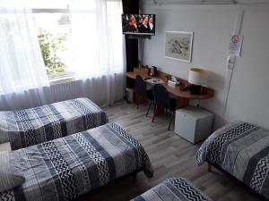 Postel nebo postele na pokoji v ubytování Hotel Baan