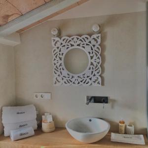 a bathroom with a sink and a mirror on the wall at Hotel Abaco Altea in Altea