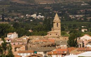 a view of a town with a clock tower at CASA SIERRA in Alberite