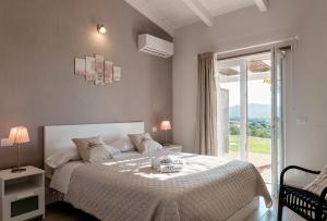 Postel nebo postele na pokoji v ubytování Podere n°8 Agriturismo in Maremma