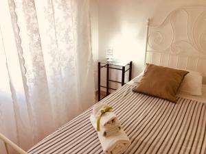 Posteľ alebo postele v izbe v ubytovaní Caio Asinio Apartment