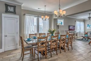 a dining room and living room with a table and chairs at Breezy Myrtle Beach Getaway, 1 Block to Beach! in Myrtle Beach