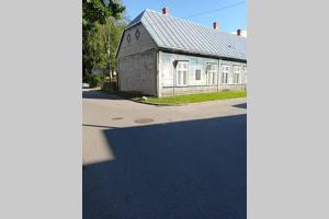 an old building in front of a street at House of Possiet in Pärnu