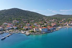 an aerial view of a small town on a body of water at Apartments Babin in Vinišće