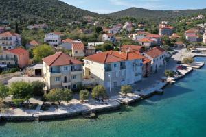 an aerial view of a town next to the water at Apartments Babin in Vinišće