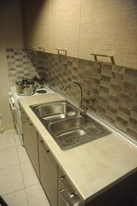 Kuchyň nebo kuchyňský kout v ubytování SEA VIEW APARTMENTS Artemis