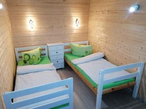 Postel nebo postele na pokoji v ubytování Domek u Beaty + 29 fotografií