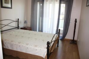 A bed or beds in a room at Fantastic Fatima Apartment