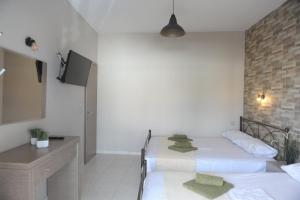 Postel nebo postele na pokoji v ubytování SEA VIEW APARTMENTS Artemis