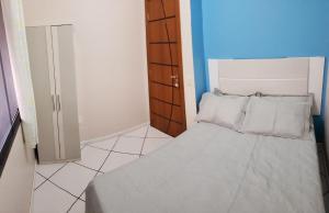 Säng eller sängar i ett rum på Casa Oliveira 2