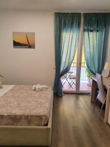 Postel nebo postele na pokoji v ubytování B&B Il Saraceno