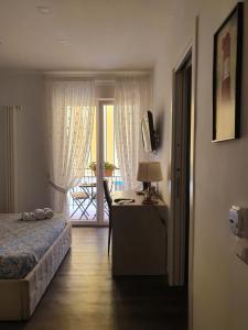 Postel nebo postele na pokoji v ubytování B&B Il Saraceno