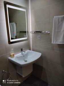 a bathroom with a sink and a mirror at CHALET ADOSADO DULCINEA Alcossebre in Alcossebre