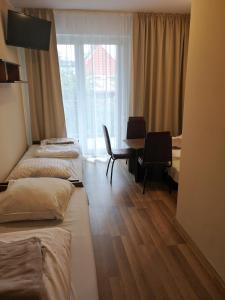 Postel nebo postele na pokoji v ubytování OWR Kamyczek