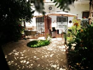 A garden outside BELLA PALERMO